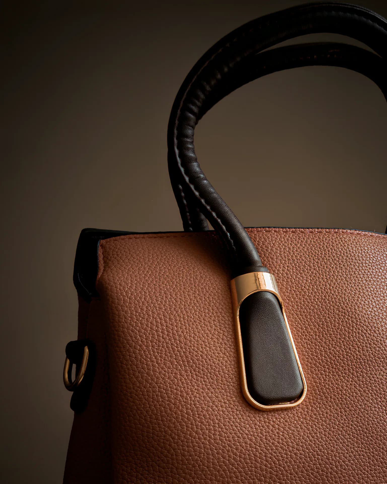 A dark product photograph with texture and shadow.