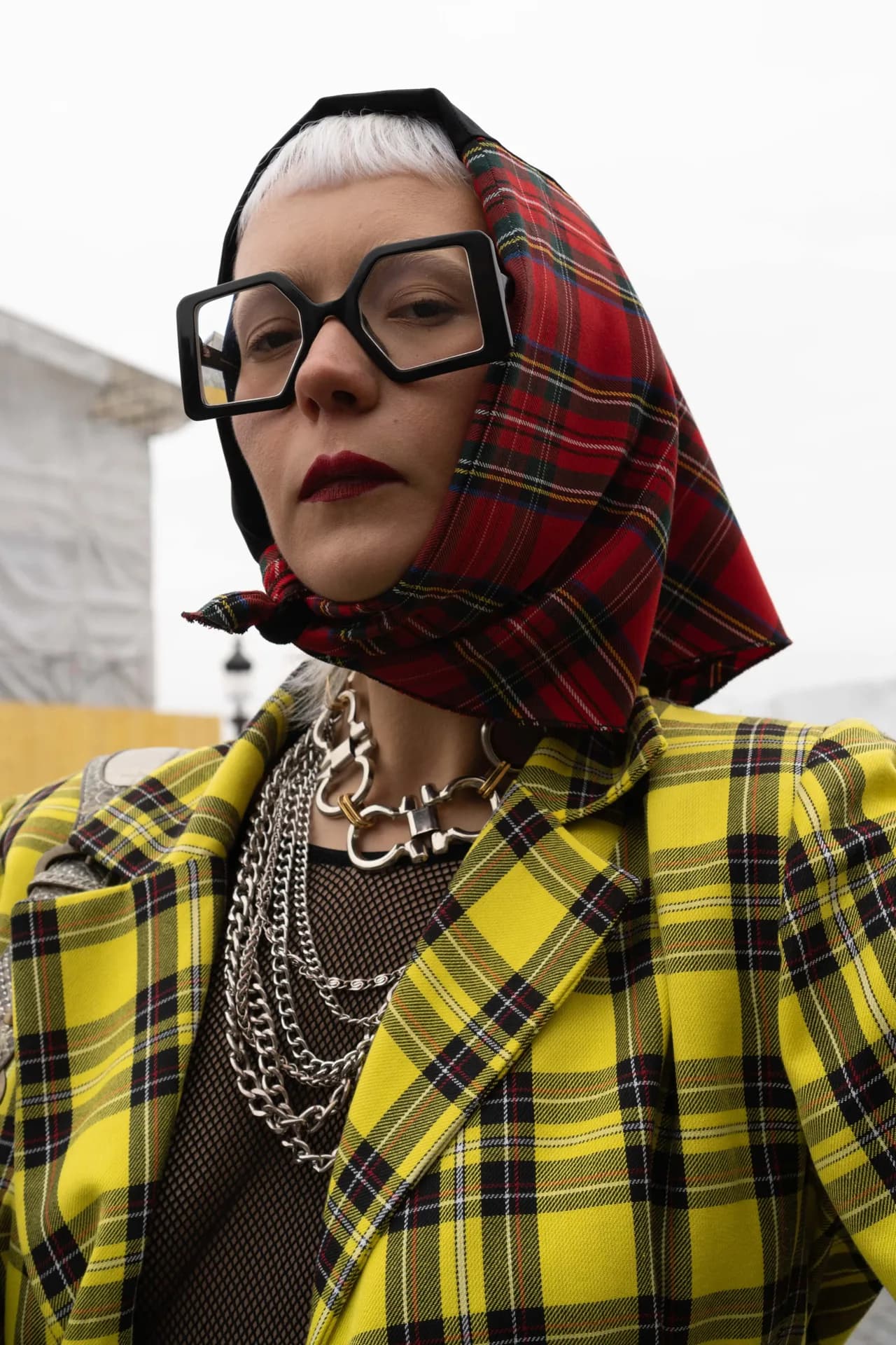 A composed fashion portrait with expressive styling.